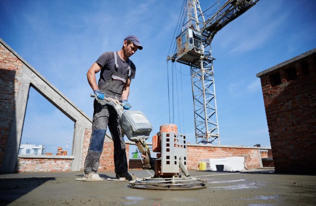 Worker leveling fresh floor with special machine 2025 01 16 23 08 34 utc